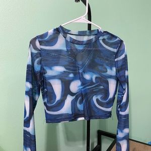 Sheer swirly blue top